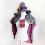 A grey cloak with purple inner lining and a grey wizard hat on a mannequin